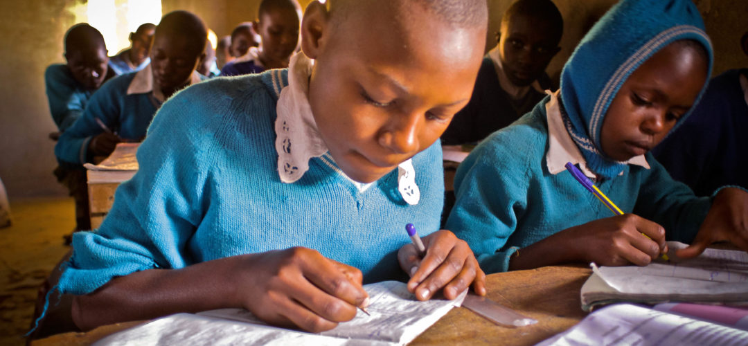 Children in a classroom. School was supported with a solar lighting project to aid pupils learn when it gets dark